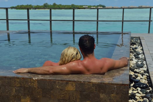 happy young  couple at summer vacation have fun and relax at beautiful sunny  day on beach