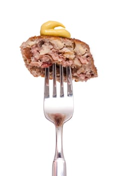 Meatball with mustard on a fork