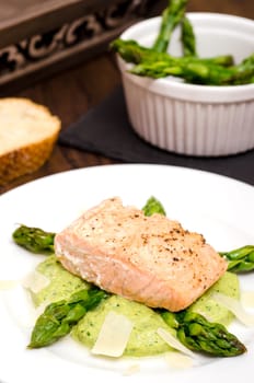 Fried salmon with pepper and green asparagus