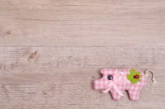 Pink pig and clover as lucky charms