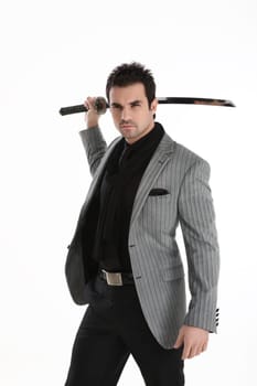 Elegant handsome man with a katana sword