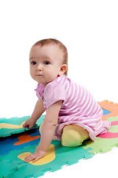 Shot of little cute baby playing with letters