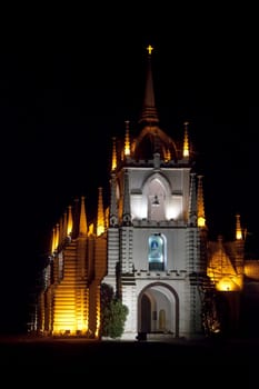 Vertical portrait of Mae de Dues Church Goa India taken from the public road surrounding the property, generic night scene of the Portuguese inspired religious architecture