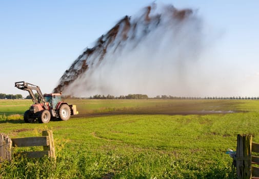 Farmer is pumping water out of a ditch
