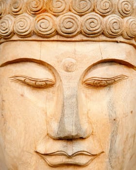 Woodcarved buddha for sale in a shop