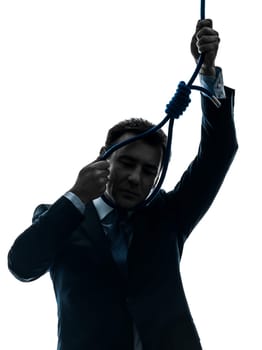 one caucasian man  holding adjusting  hangman's noose in silhouette studio isolated on white background