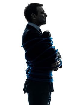 one caucasian business man tied up prisoner  in silhouette studio isolated on white background