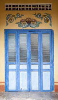 Blue temple door in Bac Chu, the Mekong Delta, Vietnam
