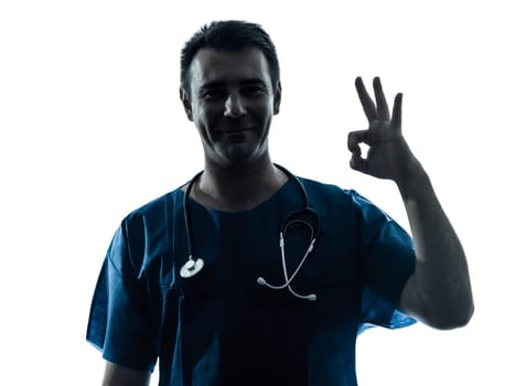 one caucasian man doctor surgeon medical worker okay gesture  silhouette isolated on white background
