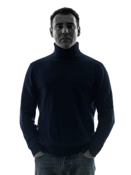 one caucasian man mature serious portrait in silhouette studio isolated on white background