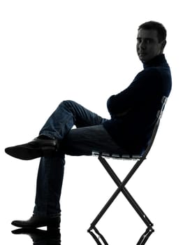 one caucasian man smiling looking at camera full length in silhouette studio isolated on white background