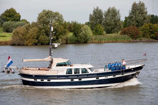 Dutch yacht on the river Lek in the Netherlands