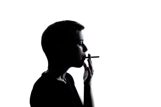 one caucasian young teenager silhouette boy or girl portrait in studio cut out isolated on white background