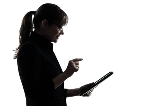 one business woman computer computing typing digital tablet  silhouette studio isolated on white background