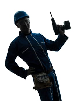 one caucasian man construction worker holding drill silhouette in studio on white background