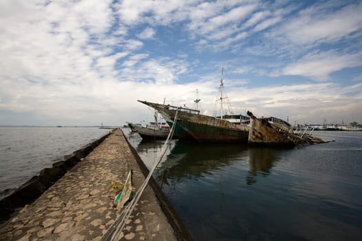 Makassar schooners (pinisi) in Paotere harbor, the old port of Makassar,  Indonesia