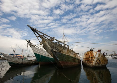 Makassar schooners (pinisi) in Paotere harbor, the old port of Makassar,  Indonesia