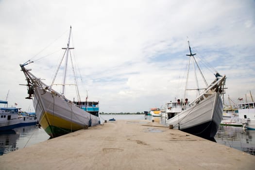 Makassar schooners (pinisi) in Paotere harbor, the old port of Makassar,  Indonesia