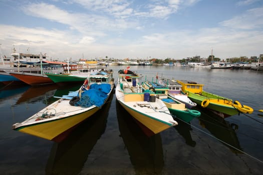 Makassar schooners (pinisi) in Paotere harbor, the old port of Makassar,  Indonesia