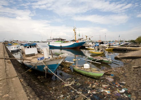 Makassar schooners (pinisi) in Paotere harbor, the old port of Makassar,  Indonesia