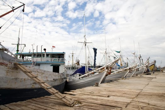 Makassar schooners (pinisi) in Paotere harbor, the old port of Makassar,  Indonesia