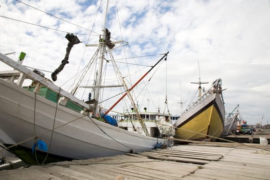 Makassar schooners (pinisi) in Paotere harbor, the old port of Makassar,  Indonesia