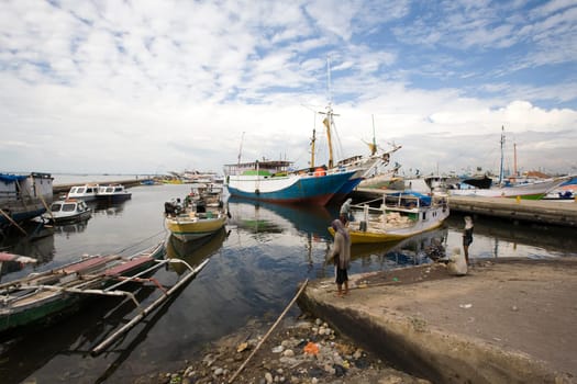 Makassar schooners (pinisi) in Paotere harbor, the old port of Makassar,  Indonesia