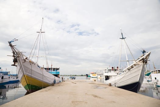 Makassar schooners (pinisi) in Paotere harbor, the old port of Makassar,  Indonesia