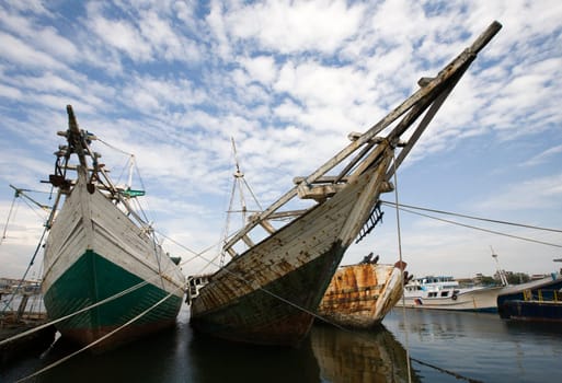 Makassar schooners (pinisi) in Paotere harbor, the old port of Makassar,  Indonesia