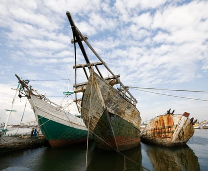Makassar schooners (pinisi) in Paotere harbor, the old port of Makassar,  Indonesia