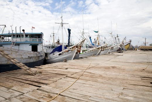 Makassar schooners (pinisi) in Paotere harbor, the old port of Makassar,  Indonesia