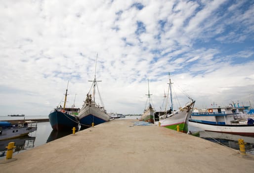 Makassar schooners (pinisi) in Paotere harbor, the old port of Makassar,  Indonesia