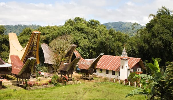 Toraja village with traditional houses and a church in Toraja, Sulawesi, Indonesia