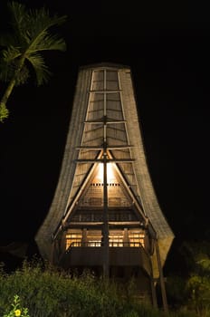 Traditional Toraja house (tongkonan) at night