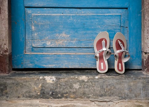 Pair of sandals at the doorstep in a Lombok village