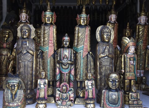 Woodcarved buddha's for sale in a shop