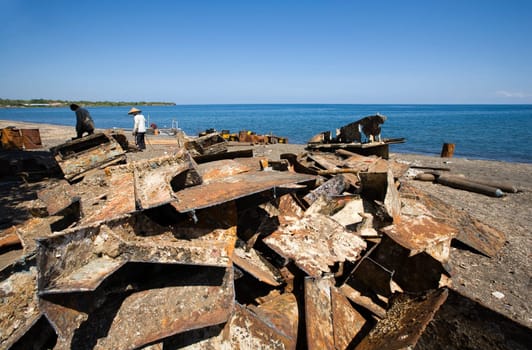 Traditional scrap yard for a wrecked ship in Lombok, Indonesia