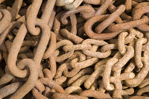 Rusty steel ship chains on a shipyard