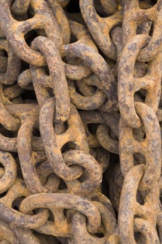 Rusty steel ship chains on a shipyard