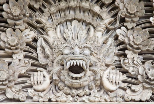 Traditional stone carving in a temple in Bali