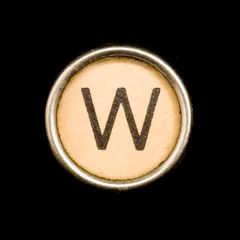 The W button on a complete alphabet of an antique typewriter