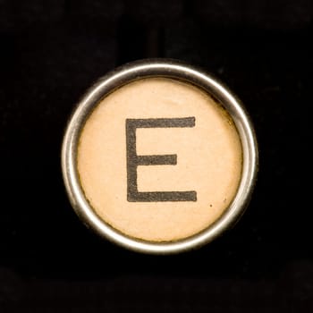The E button on a complete alphabet of an antique typewriter