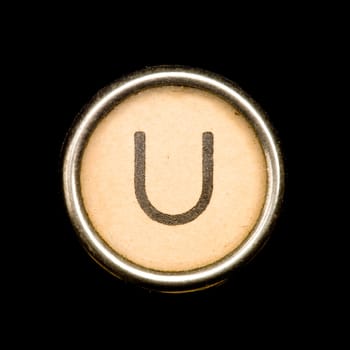 The U button on a complete alphabet of an antique typewriter