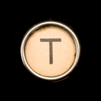The T button on a complete alphabet of an antique typewriter