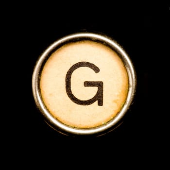 The G button on a complete alphabet of an antique typewriter