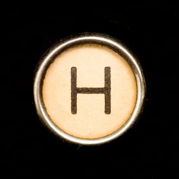 The H button on a complete alphabet of an antique typewriter