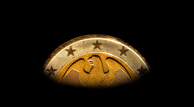 Coin of the European Union against a black background