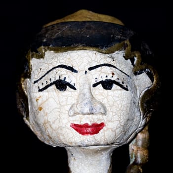 Antique indonesian puppet for sale in an antique shop