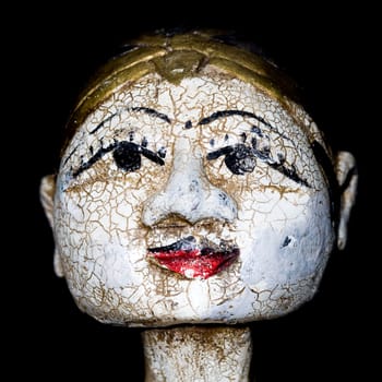 Antique indonesian puppet for sale in an antique shop