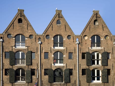 Façade of canal houses in Amsterdam, the Netherlands